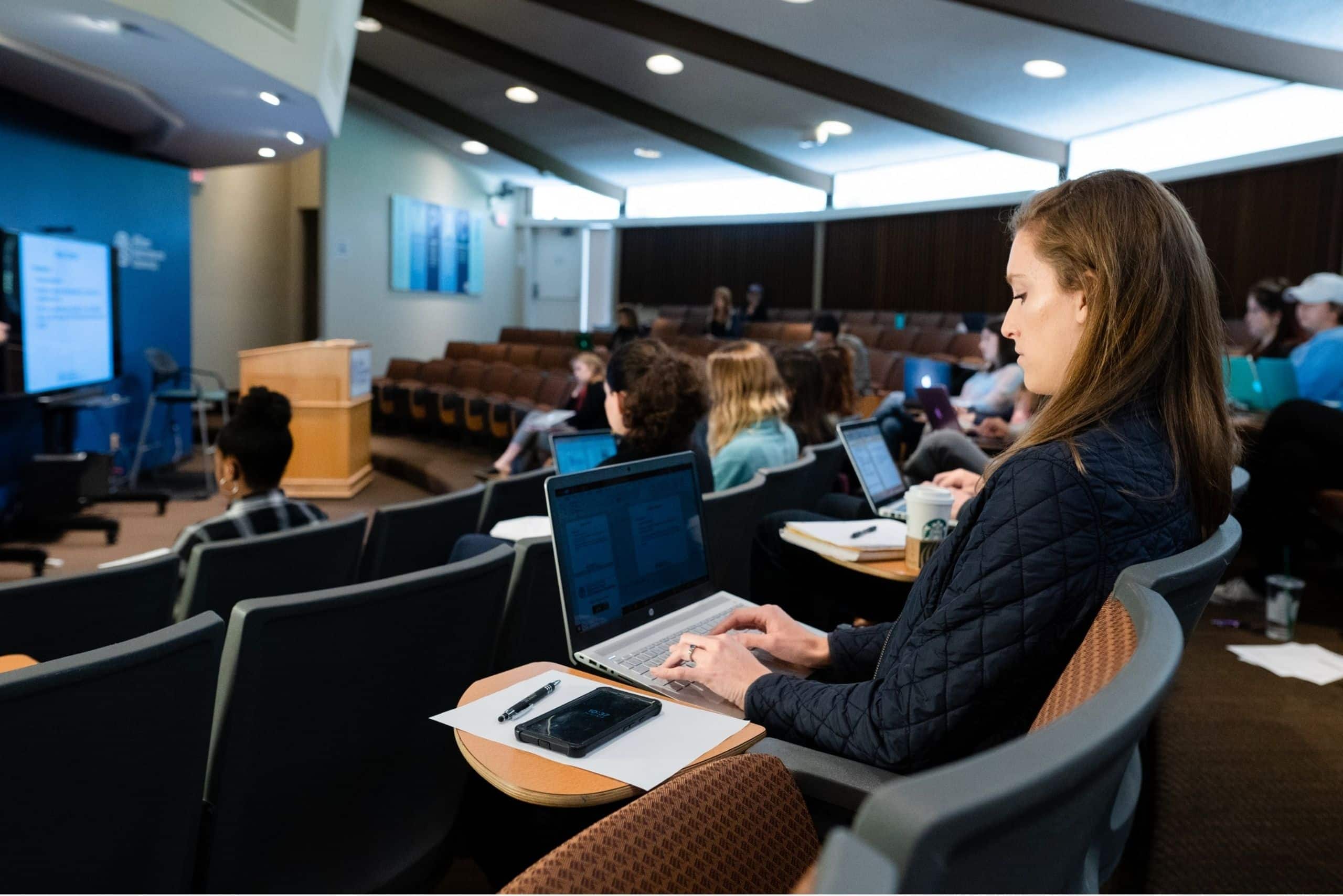 Student on computer at an international University lecture